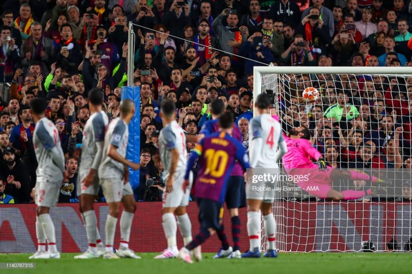 Lionel Messi of FC Barcelona scores a goal against Liverpool FC