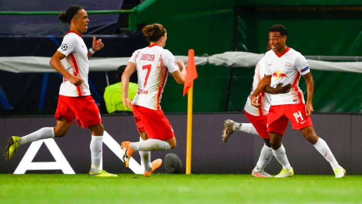 RB Leipzig players celebrate after victory against Atletico Madrid